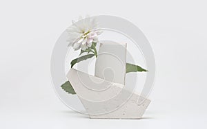 Stones platform podium and flower on gray light copy spase background. Minimal empty display product presentation scene photo
