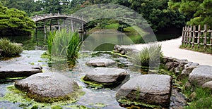 Stones in pond of Ritsurin Koen Garden Takamatsu Japan