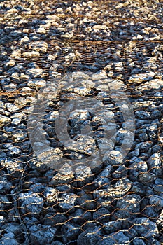 Stones protected by chain link