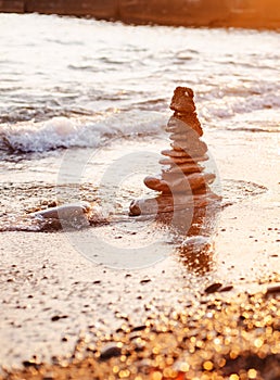 stones of the pyramid on the beach symbolize the concept of Zen, harmony, balance