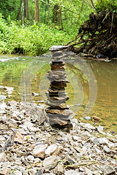 Stones pyramid near small river