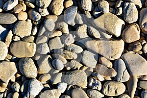 Stones on the river bank, stone background