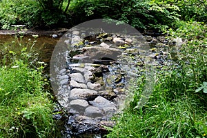 Stones and Rocks Across a River in a Country Park