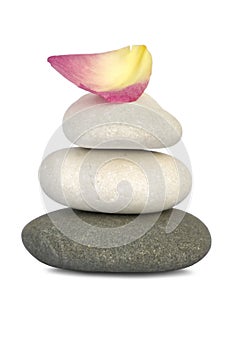 Stones and rose petal in balance