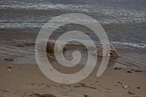 Stones and sand on the shores of the Gulf of Finland