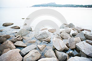 Stones on Shore in La Colba Bay on North Sardinia, Italy. Beach of Rena di Ponente photo