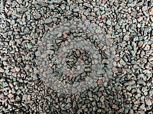 The stones are small, crushed stone, foreshortening from above, background