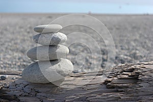 Stones stack in zen style on the beach on sunny day