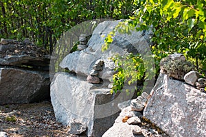 Stones stacked in a pyramid along the road.