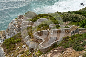 Stones steps going to the the rocks cliffs at the Cape of Good Hope in South Africa.