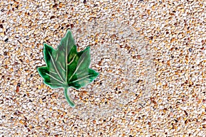 Stones texture with green leaf tile for background