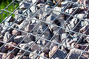 Stones under a metal grate. Background