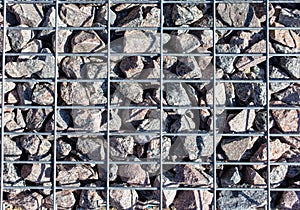 Stones under a metal grate. Background