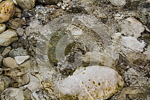 Stones under water. Blurred background