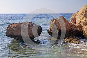 stones in the water on the beach. stones cut by water in the red sea sinai peninsula