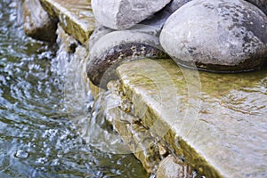 Stones in water on beauty town Ternopil