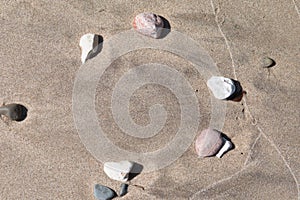 Stones in wet sand
