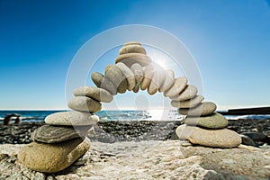 Zen basalt stones at the seaside on background