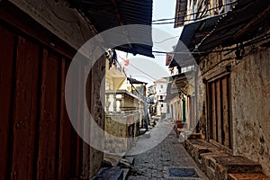 Stonetown Tanzania, Zanzibar Archipelago. Streets and harbour in old Stone Town of Zanzibar City, historical colonial stony