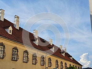 Stonewall and windows of old building in ancient European village Maria Taferl photo