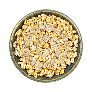 Stoneware bowl filled with puffed honey wheat cereal