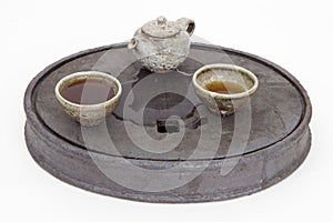 Stoneware tea set on a ceramic tea tray
