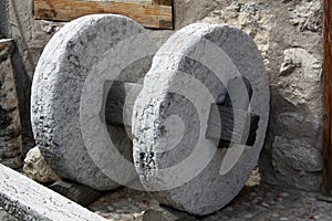 Stonewheel detail near a millstone in Guardia, Trentino, Italy photo