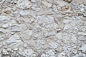 Stonework background. White stone wall.