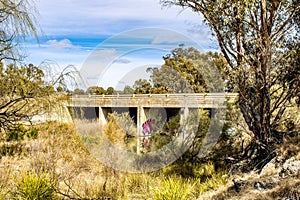 Stoney Creek Bridge between the dried plants and trees in New South Wales, Australia