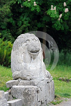 Stony chapped figure of lion at entrance to Olesko Castle