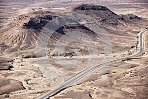 Stony desert landscape with road