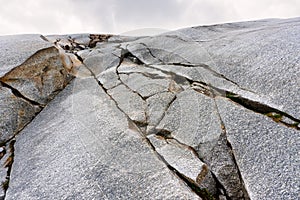 Stony embossed rocks of the Rhone Glacier at Furka Pass, Valais, Switzerland.