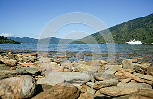 Stony foreground in picturesque Endeavour Inlet in Marlborough Sounds