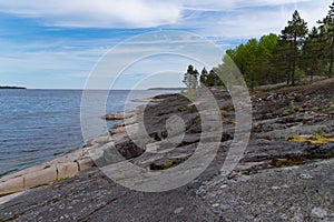 Stony lake shore on Great Ladoga Trail. Leningrad region. Russia