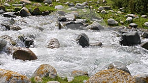 Stony mountain river with fast waterflow in Kyrgyzstan