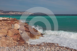 Stony and pebble coast of sea gulf. Nice, France