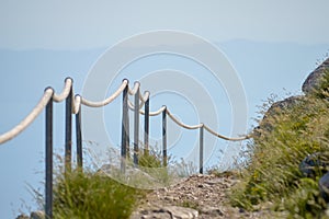 Stony road with rope fence on the peak Sv. Jure in Biokovo national park