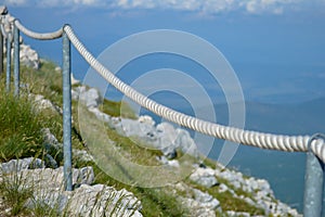 Stony road with rope fence on the peak Sv. Jure in Biokovo national park