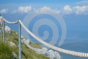 Stony road with rope fence on the peak Sv. Jure in Biokovo national park