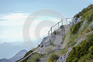 Stony road with rope fence on the peak Sv. Jure in Biokovo national park