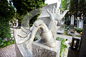 Stony sculpture hands on Vlasta Burian grave in Vysehrad cemetery in Prague, Czech Republic