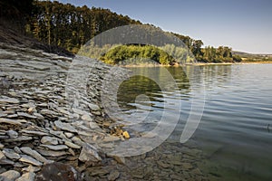 Stony steep shore of the Ticha dam