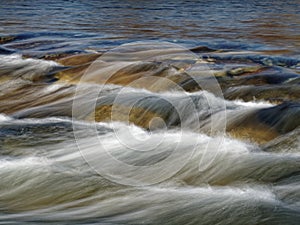 stony stream in the forest long exposure