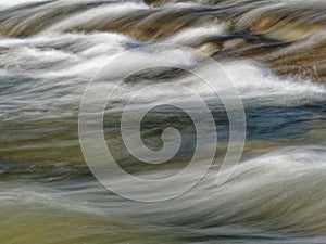 stony stream in the forest long exposure