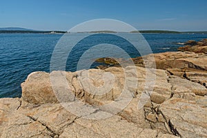 Stood Bay and the familiar Pink Granite slabs of rocks on the Ma
