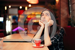 Bored Girl Waiting for her Date in a Coffee Shop