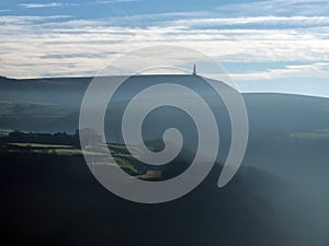 Stoodley pike in west yorkshire with morning mist in winter