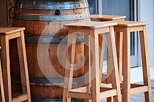 Stools and table on the terrace of a bar photo