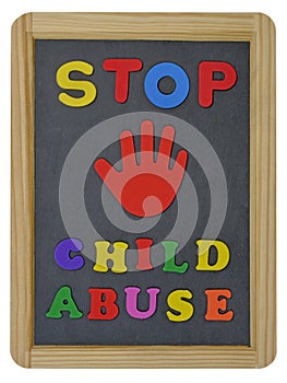 Stop child abuse in colored letters written on slate