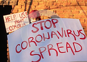 STOP CORONA SPRED Banner. Young people protest for Corona virus. pandemic global panic photo